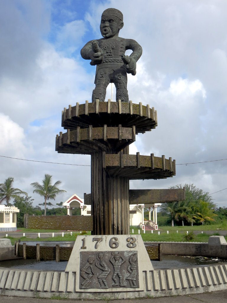 Photographers caption: "The 1763 Monument on Square of the Revolution in Georgetown, Guyana, was designed by local artist Philip Moore. It commemorates Cuffy, leader of the 1763 slave rebellion on the Bernice sugar plantation."